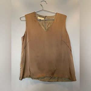 Paul Costelloe Collection top is a V-neck, sleeveless silk blouse